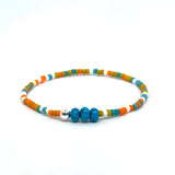 Beaded and Orange Cord Knot Bracelet by Ruigos.